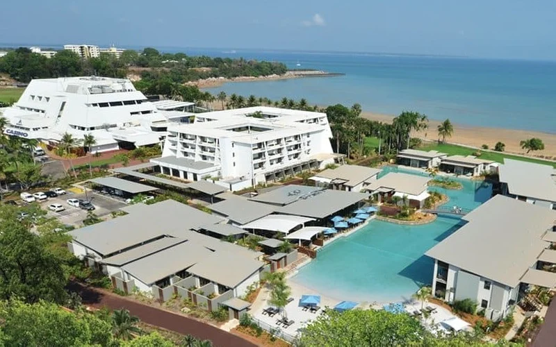 Sky City Darwin casino building shot from a bird's eye view. Pools and ocean are also visible
